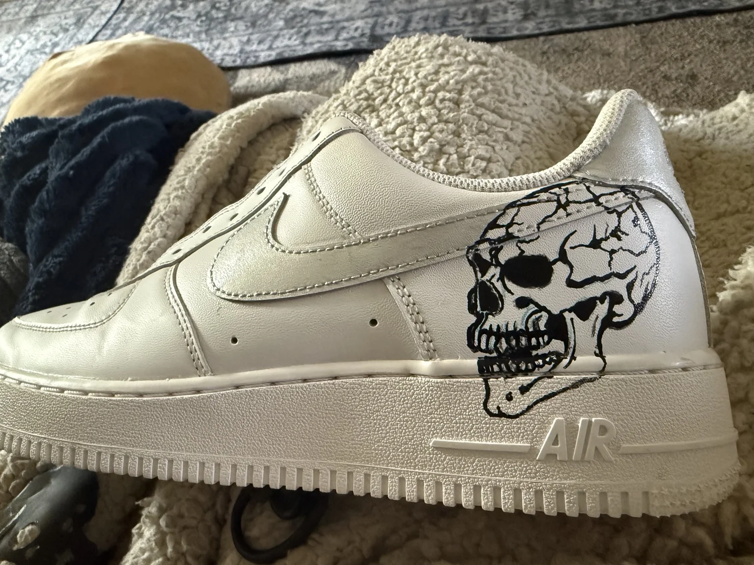 Matching skull heel artwork on custom sneakers
